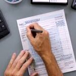 A Person Signing Document  - Tax Forms to be Considered When a Loved One Passes